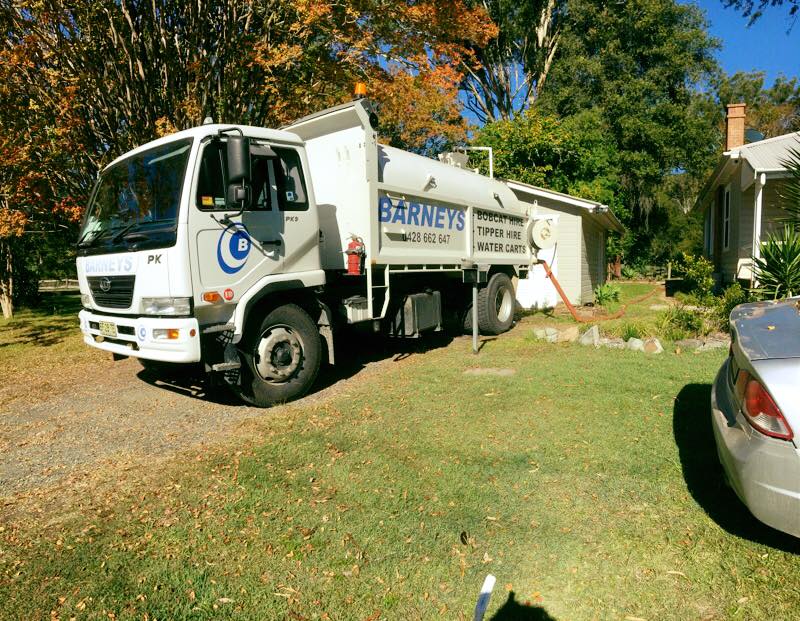 Water Truck In Residential Area — Water Cartage in Morisset, NSW