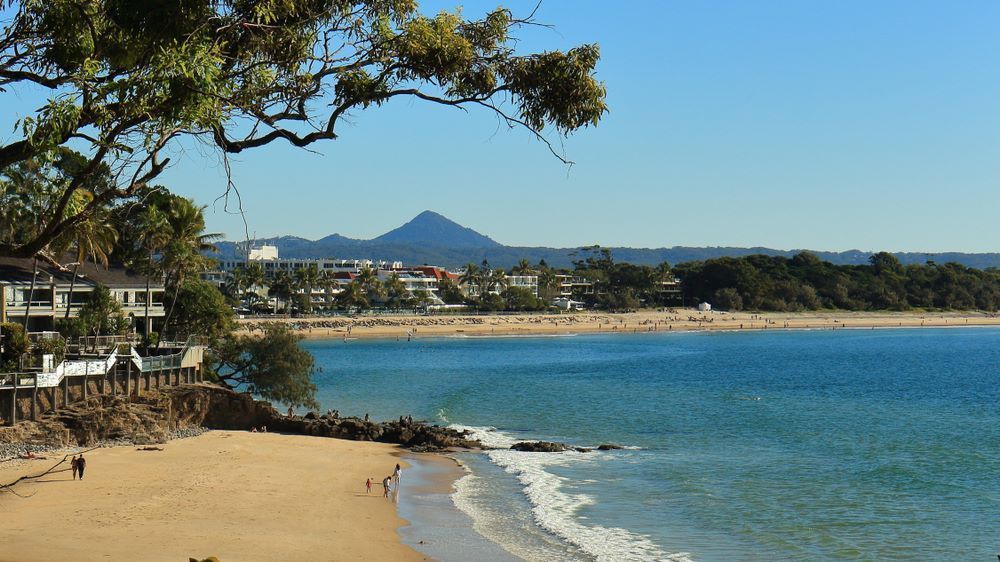A Beach With a Mountain in the Background — Arbaron Pty Ltd in Noosa, QLD