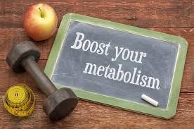 A chalkboard with the words `` boost your metabolism '' written on it.