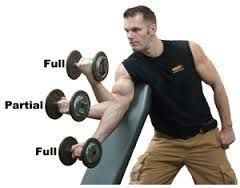 A man is holding three dumbbells on a bench.