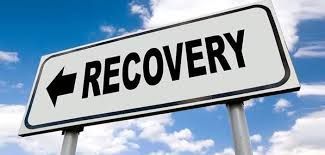 A sign that says `` recovery '' with an arrow pointing to the right.