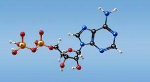 A model of a chemical compound is flying through the air against a blue sky.