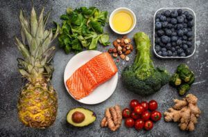 There are many different types of fruits and vegetables on the table.