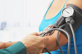 Picture of woman's arm being measured for blood pressure