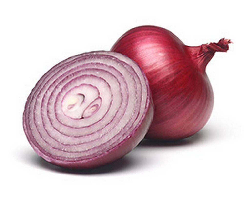 A red onion is cut in half on a white background