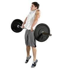 A man is holding a barbell over his head.