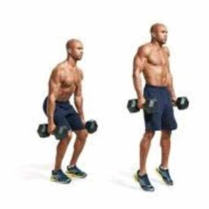 A man is squatting with dumbbells in his hands.