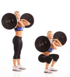 A woman squatting with a barbell on her shoulders