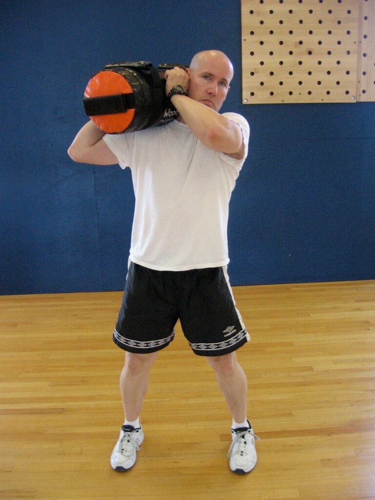 TAKU Shouldering a Sand-Bag