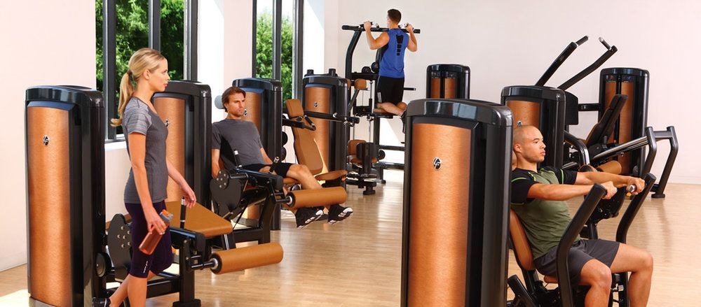 A group of people are working out in a gym.