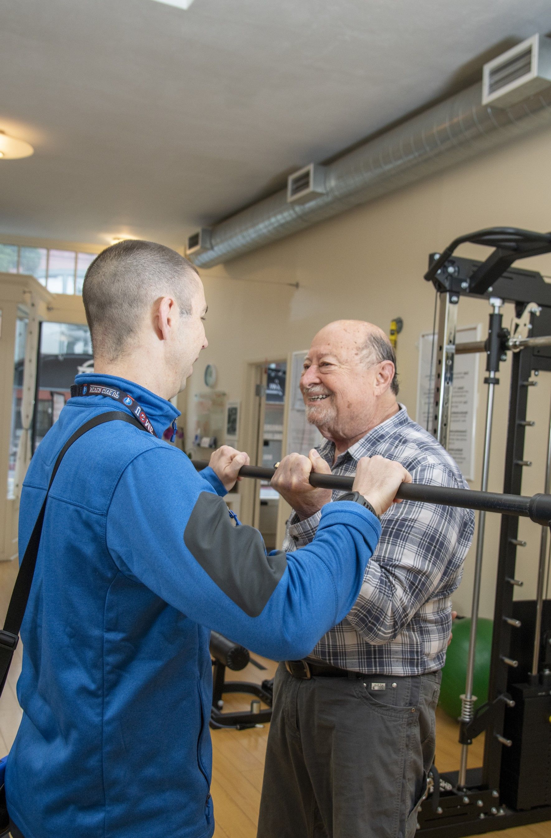 Jesse Schmidt TNT Strength coach with client