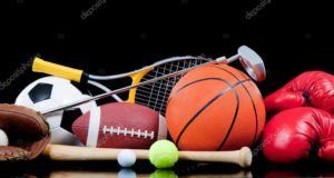 A bunch of sports balls , gloves , a basketball , a soccer ball , a tennis ball