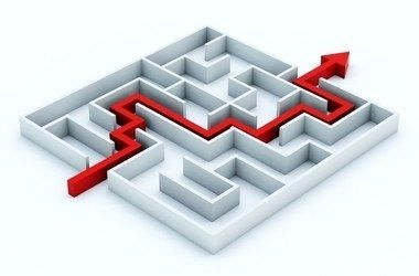 A maze with a red arrow going through it