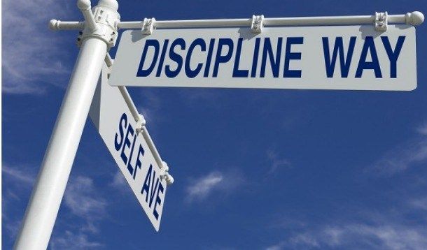 A street sign for discipline way and self ave