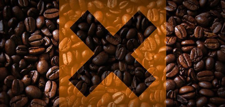 A pile of coffee beans with a cross in the middle.