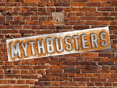 A sign on a brick wall that says mythbusters