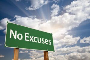 A green sign that says no excuses is against a cloudy sky.