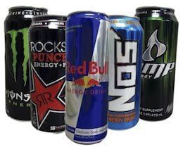 A group of cans of energy drinks are sitting next to each other.