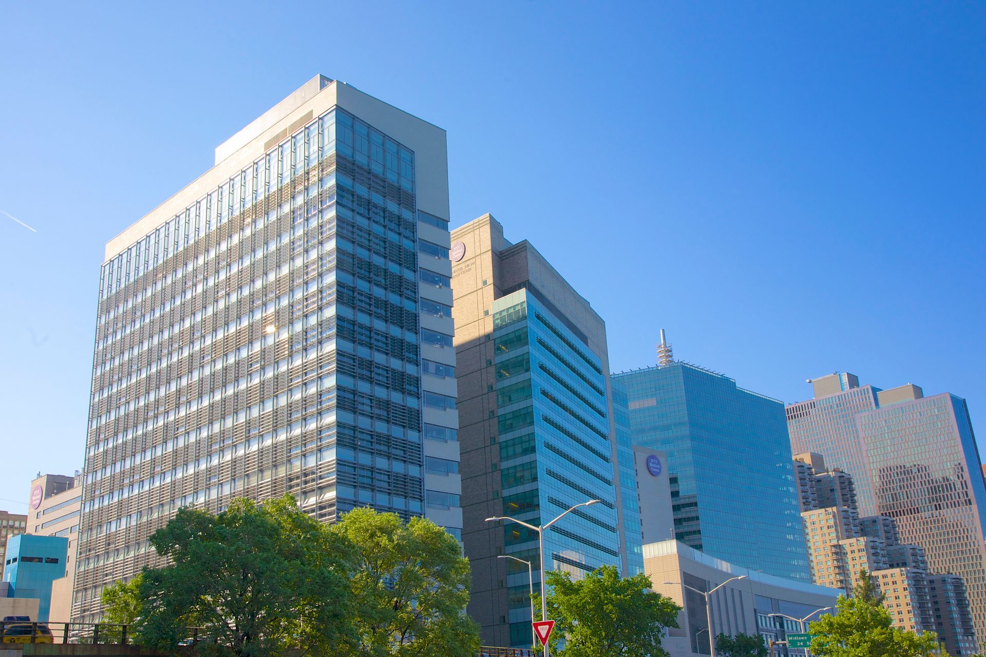 A bunch of pipes are connected to each other in a hole in the ground.