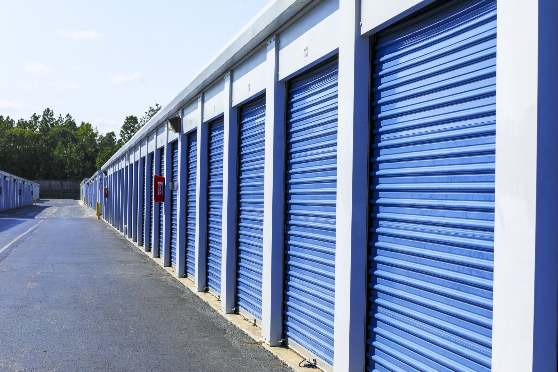 custom industrial shed - Row of Storage Sheds with roller doors