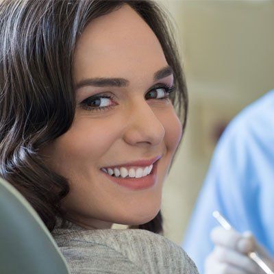 Cosmetic Dentistry — Woman Having Whitening Treatment in Coon Rapids, Minnesota