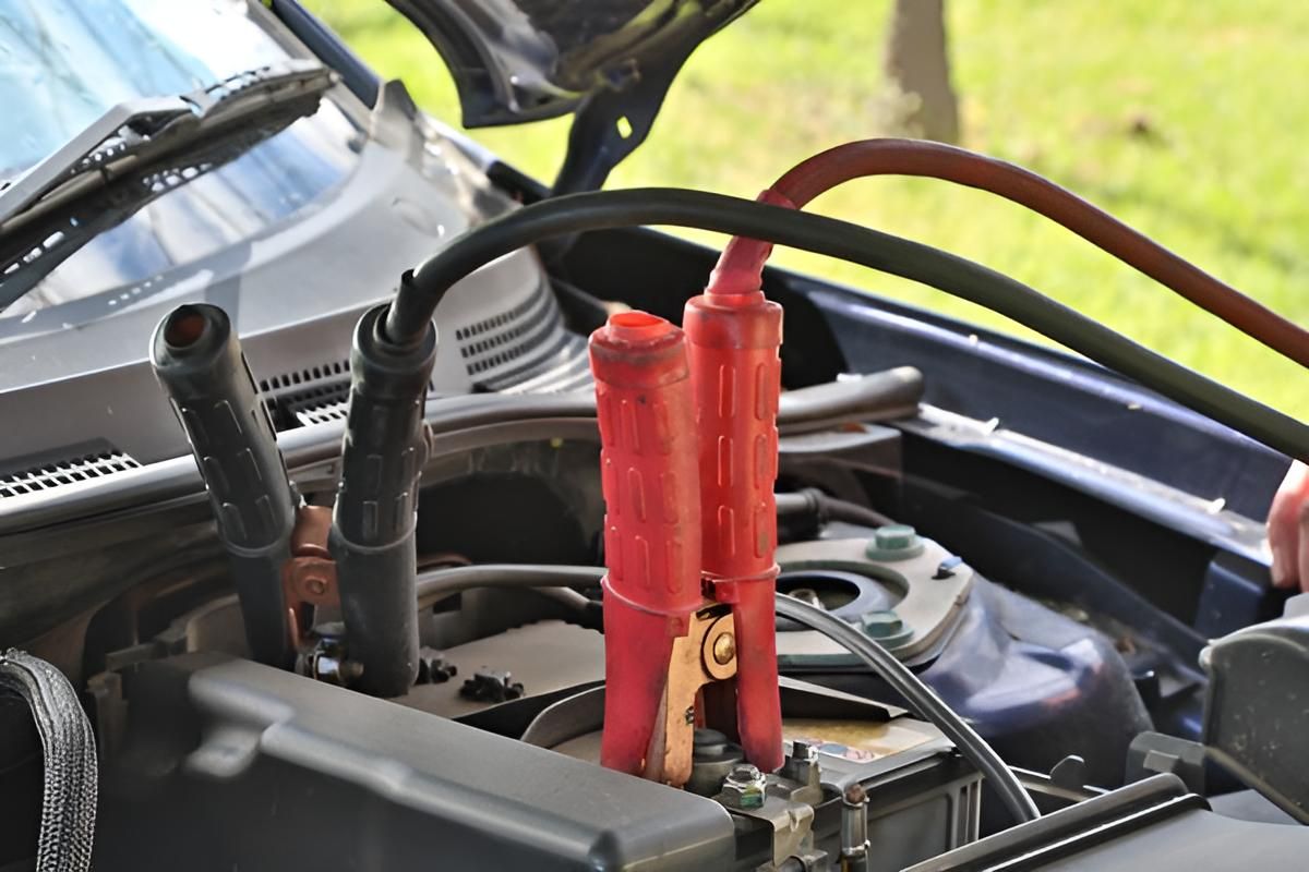 A Person Is Charging a Car Battery — Envy Automotive in Gorokan, NSW