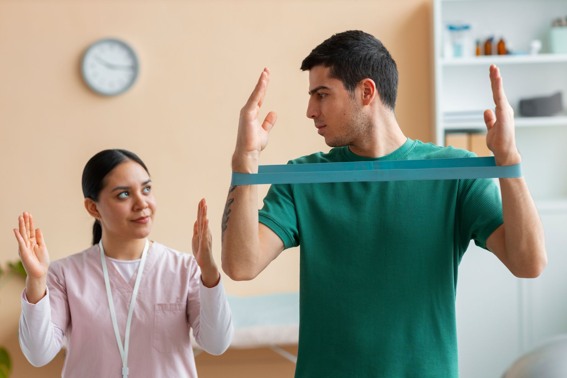 A man and a woman are doing exercises with a resistance band.