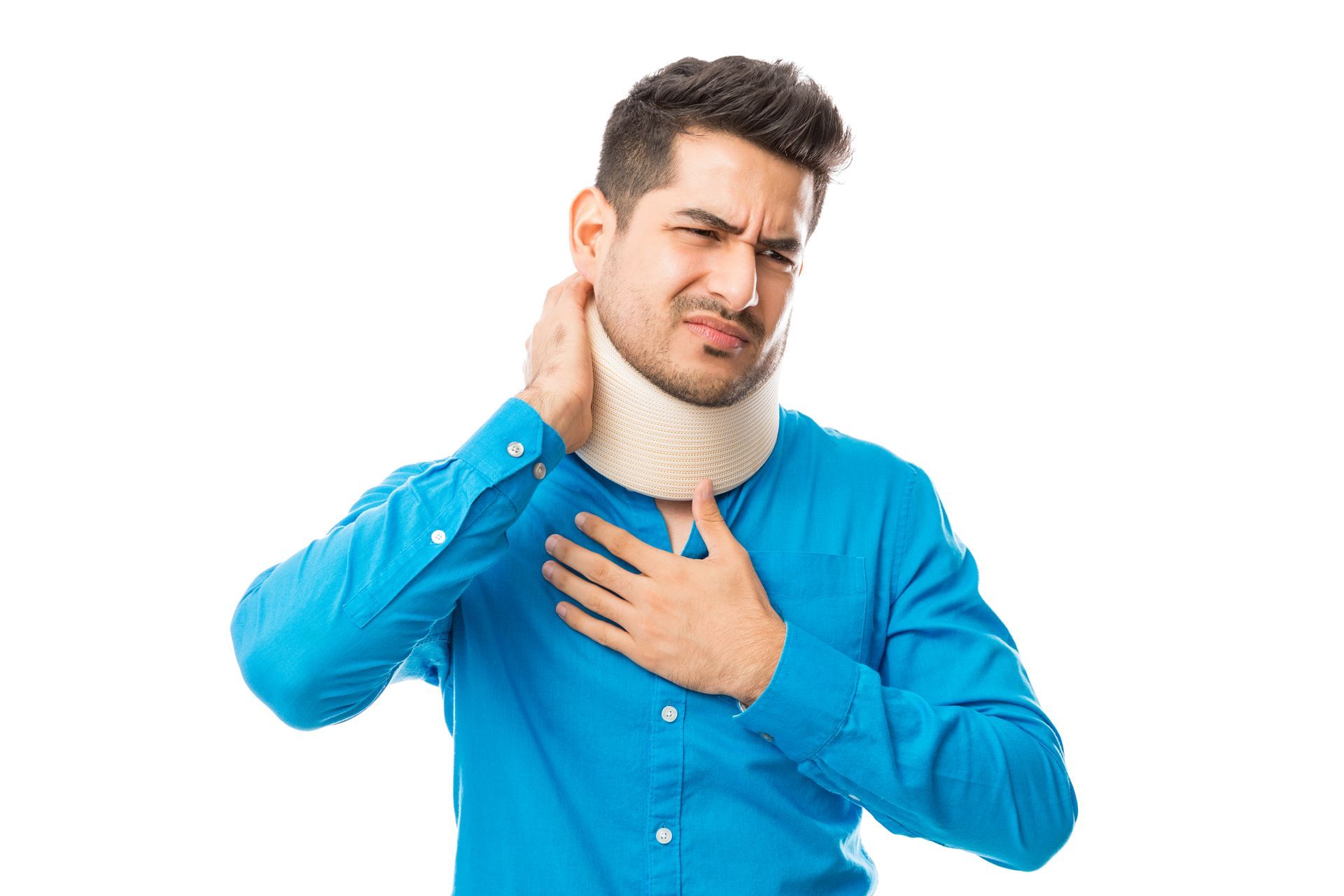 Man in blue shirt holding his neck and chest, grimacing in pain against a white background