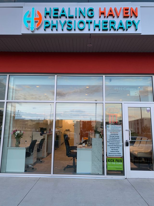 Healing Haven Physiotherapy storefront with glass doors, windows, and blue-orange sign above entrance