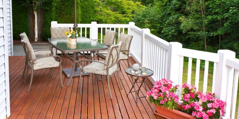Air conditioning units with toolbox and gloves in backyard.