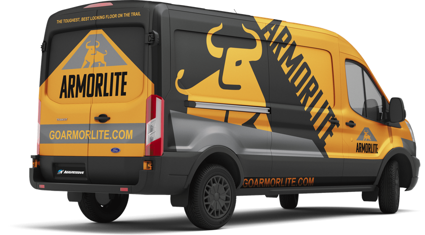 A yellow and black van with armorlite written on the back.