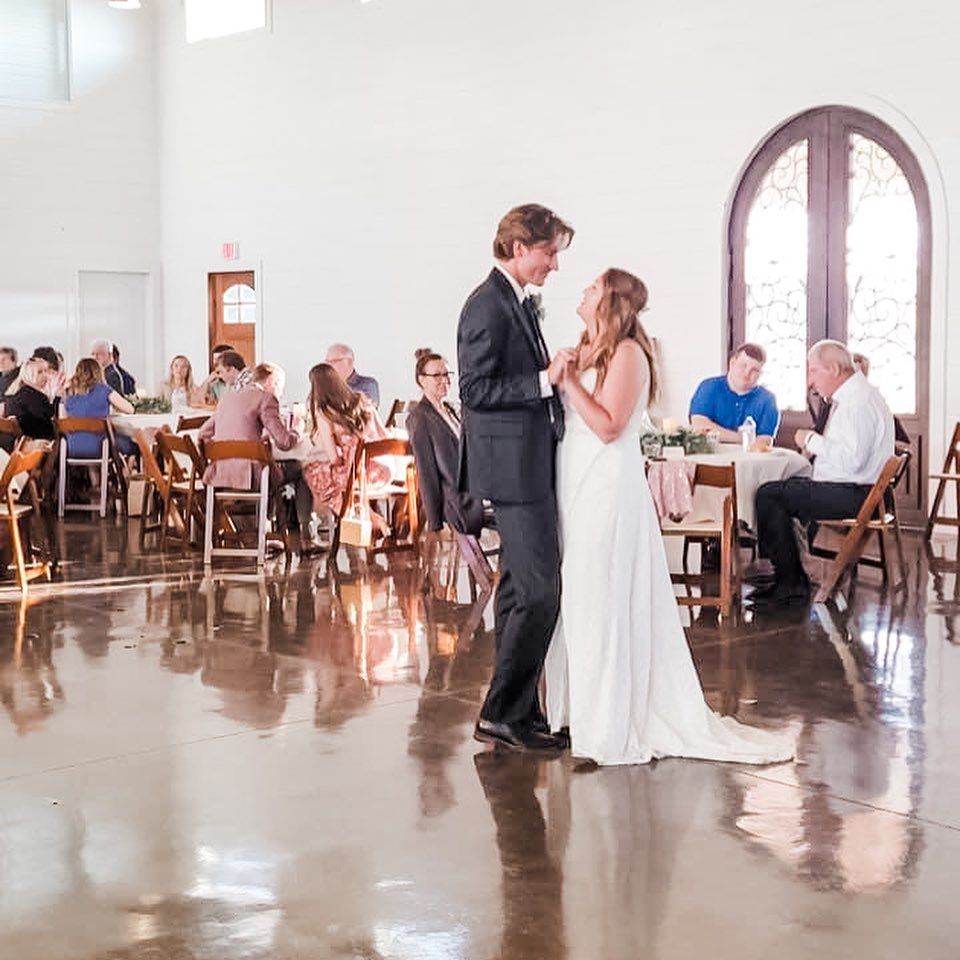 bride and groom having first dance