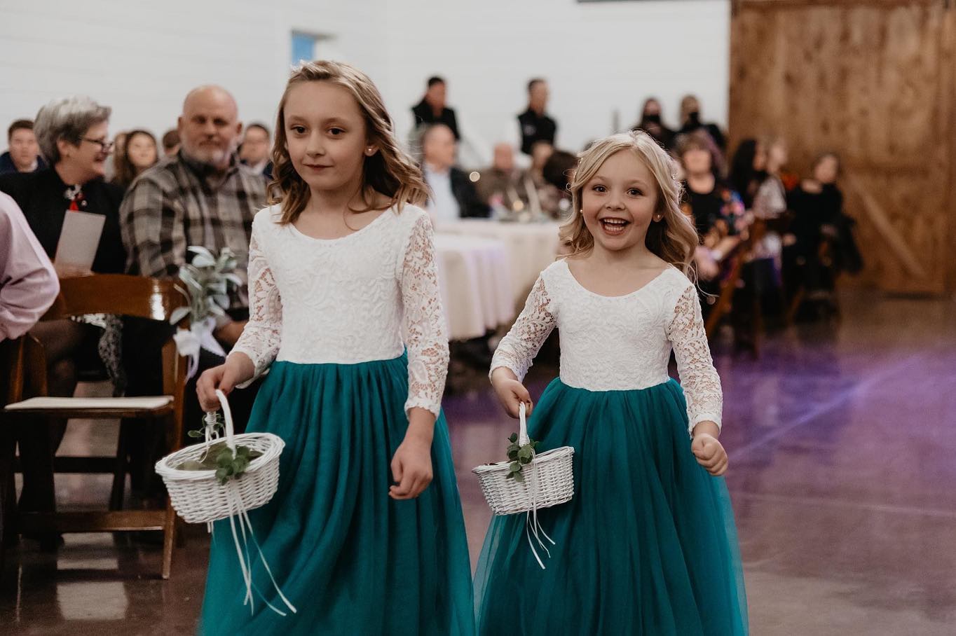 flower girls in green dresses