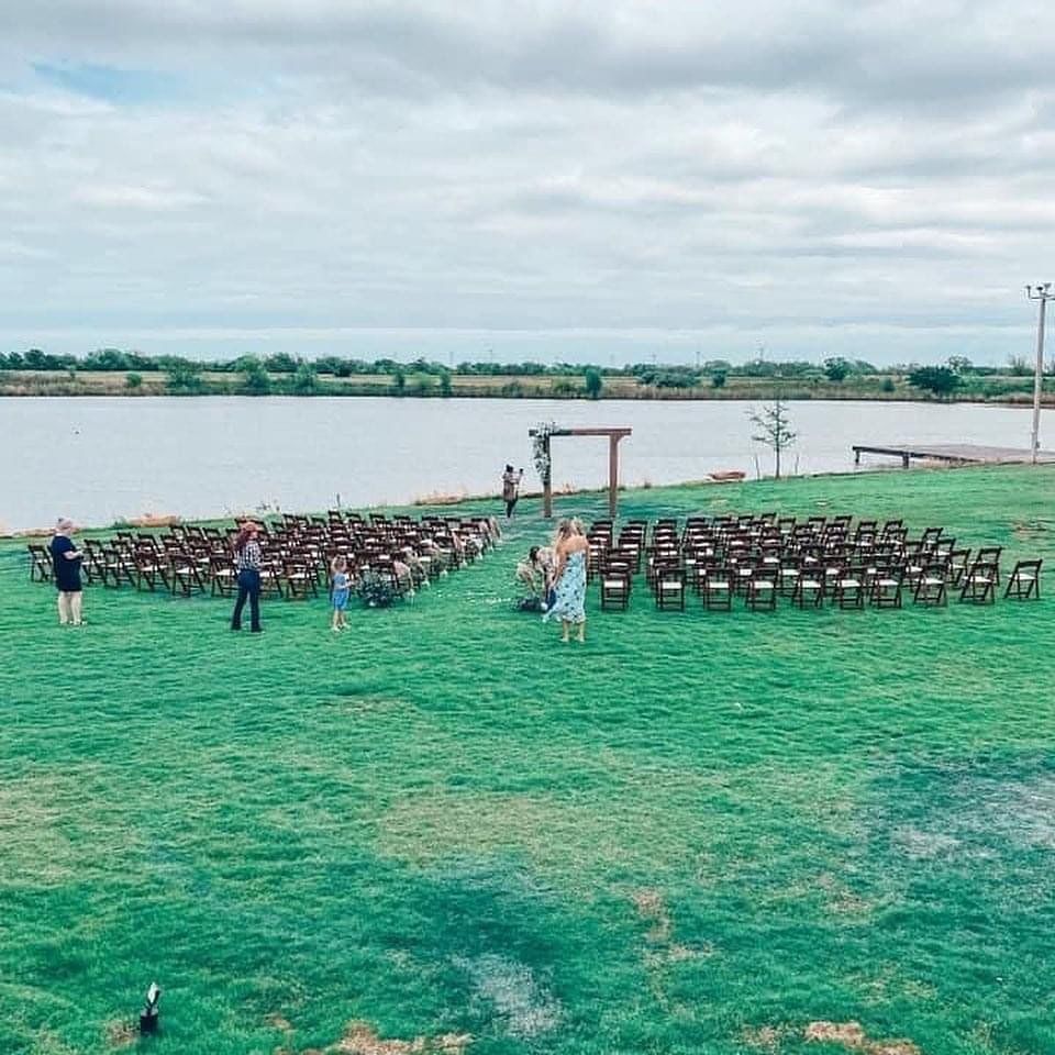 People seated at outdoor wedding venue