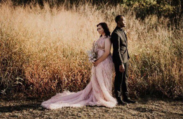 bride and groom facing away from each other