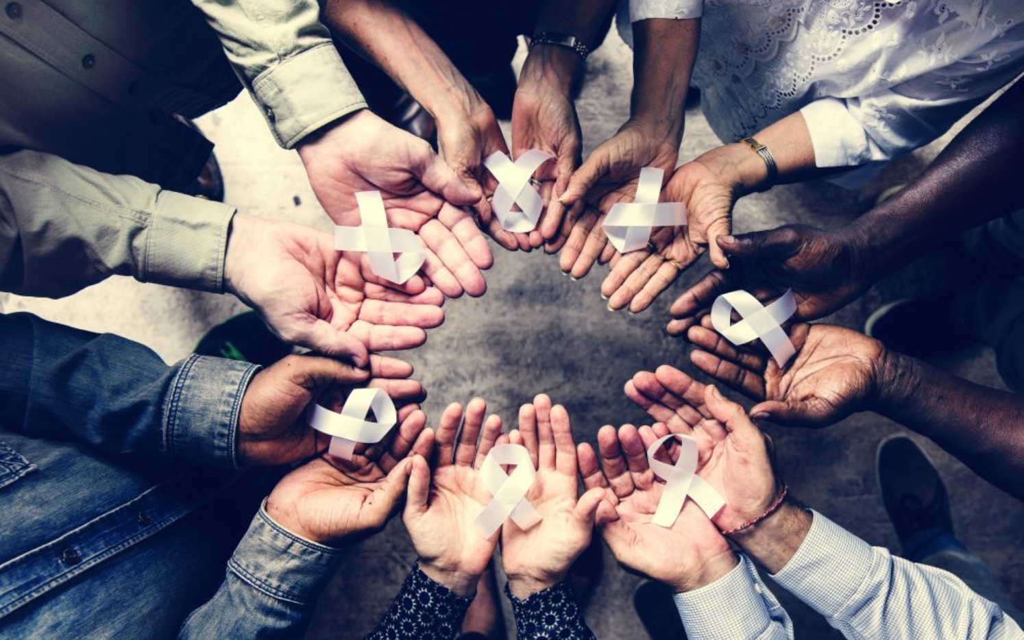 Couple reviews document with a professional in a modern office setting.