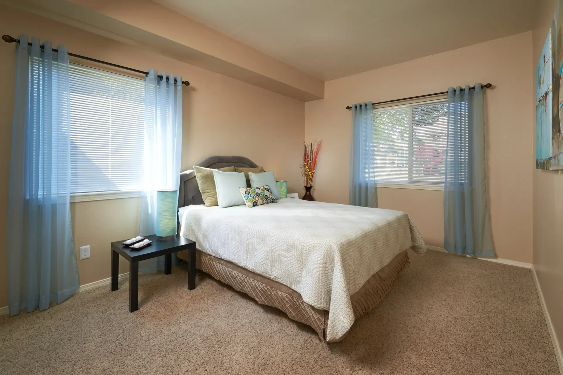 Bedroom with blue curtains