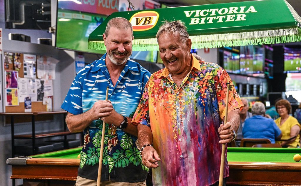 Two Delighted Men Holding Billiard Cues — Pub in Stuart Park, NT