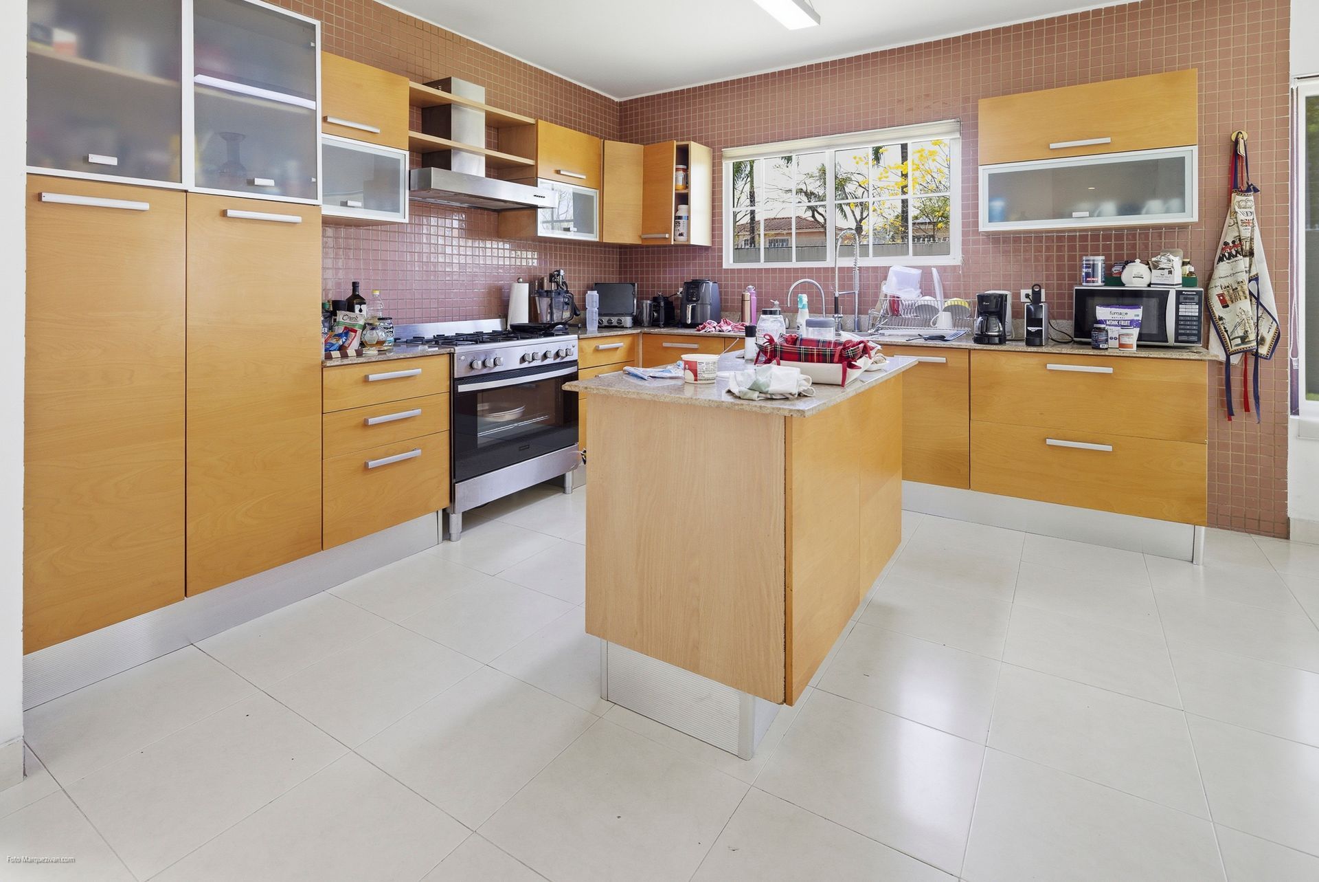 Costa del Este kitchen as captured on-site before digital declutter, Panama luxury real estate photography.