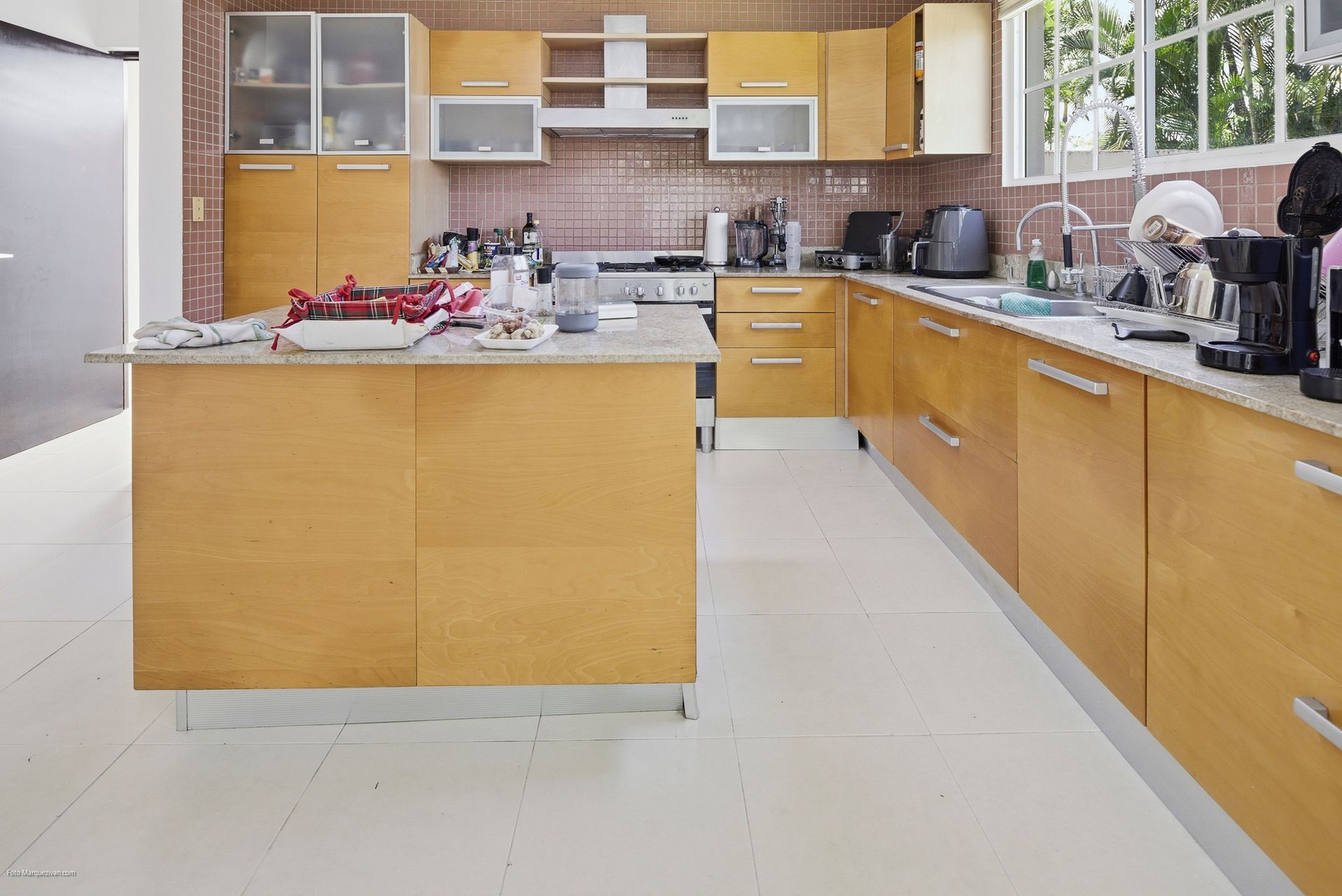 Costa del Este kitchen as captured on-site before digital declutter, Panama luxury real estate photography.