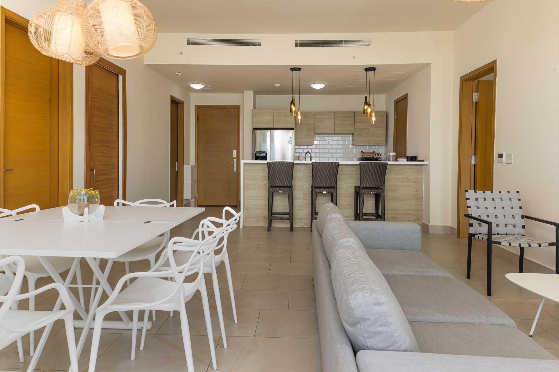 Open kitchen with pendant lights and breakfast bar in short-term rental at Playa Escondida