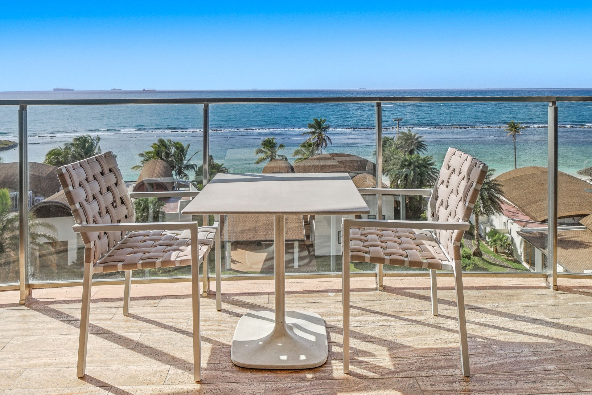 Private terrace with outdoor dining and Caribbean coast view at Playa Escondida Resort, Panama