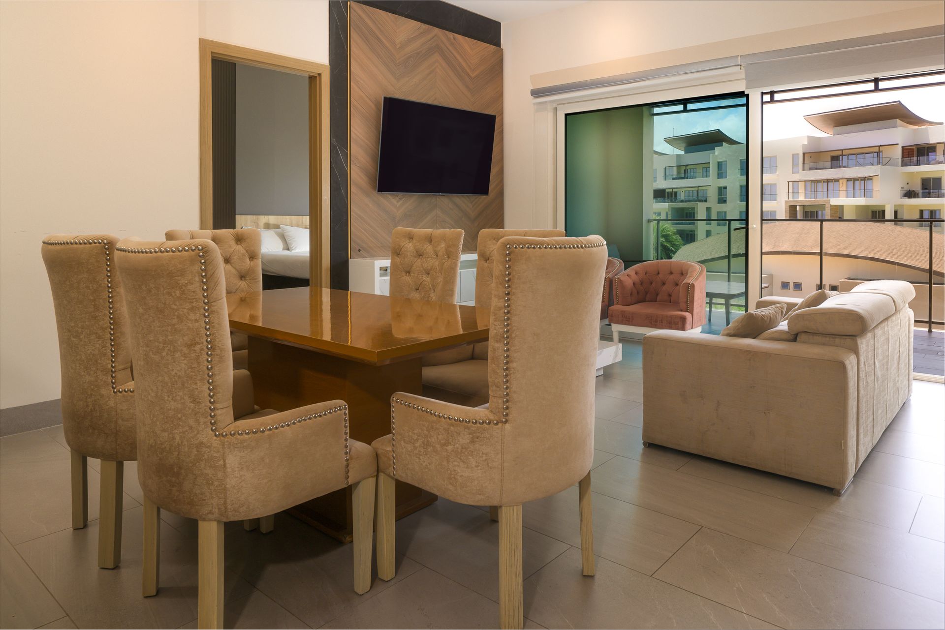 Dining area with wooden table and wicker chairs in Airbnb apartment at Playa Escondida, Panama