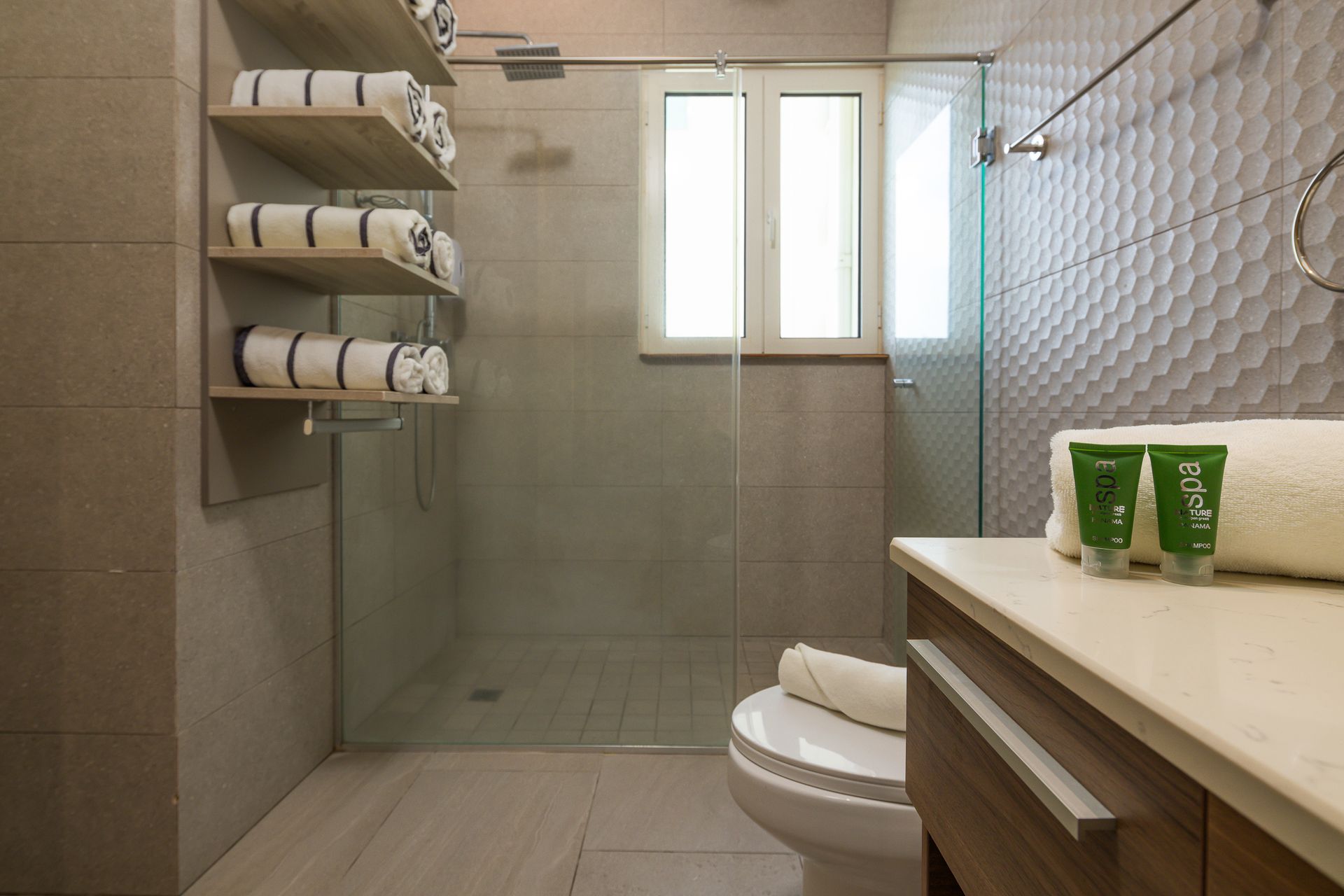Alt: Guest bathroom with modern fixtures in short-term rental at Playa Escondida, Panama Caribbean