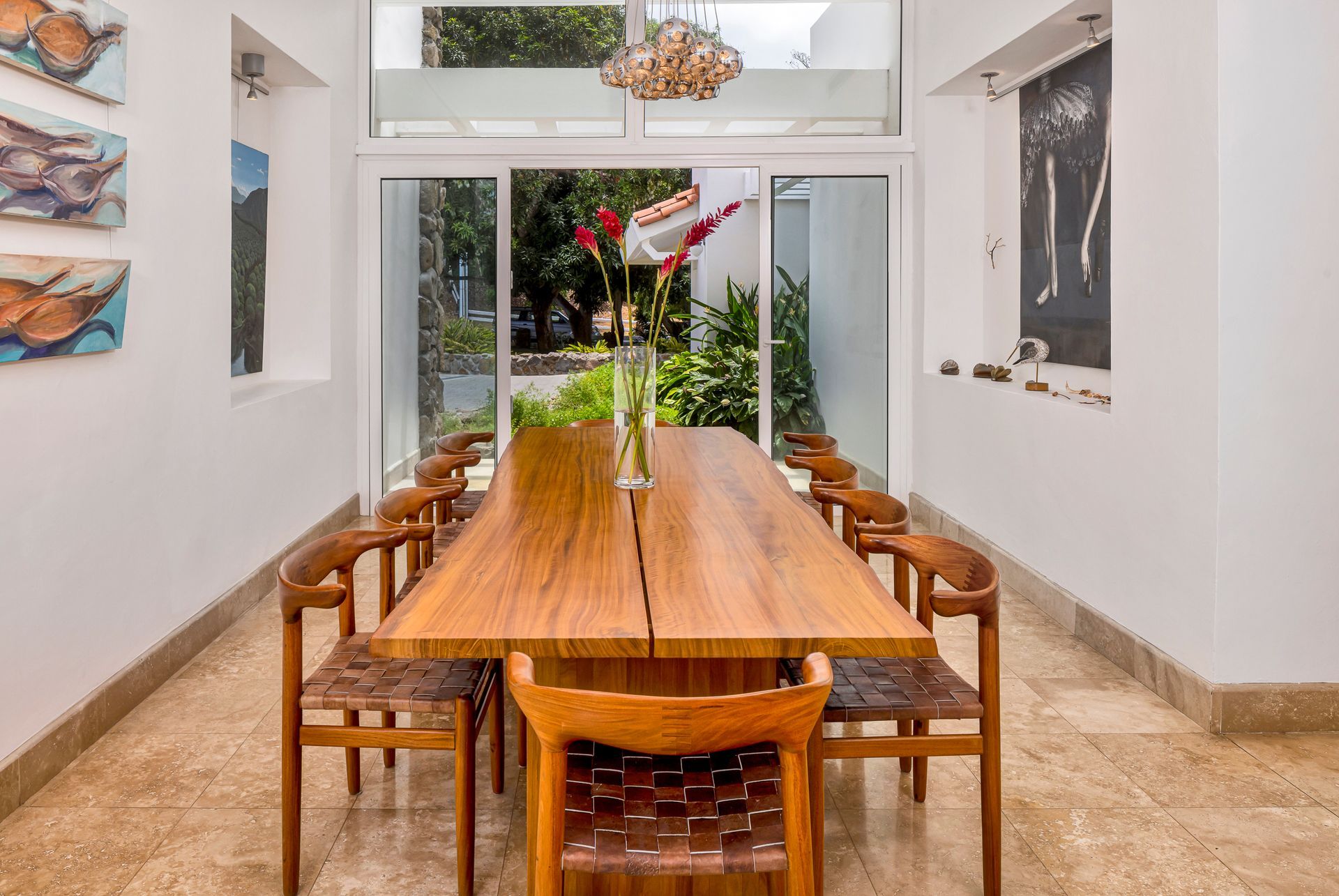 Interior design photography of a wooden dining table in a luxury beach house.
