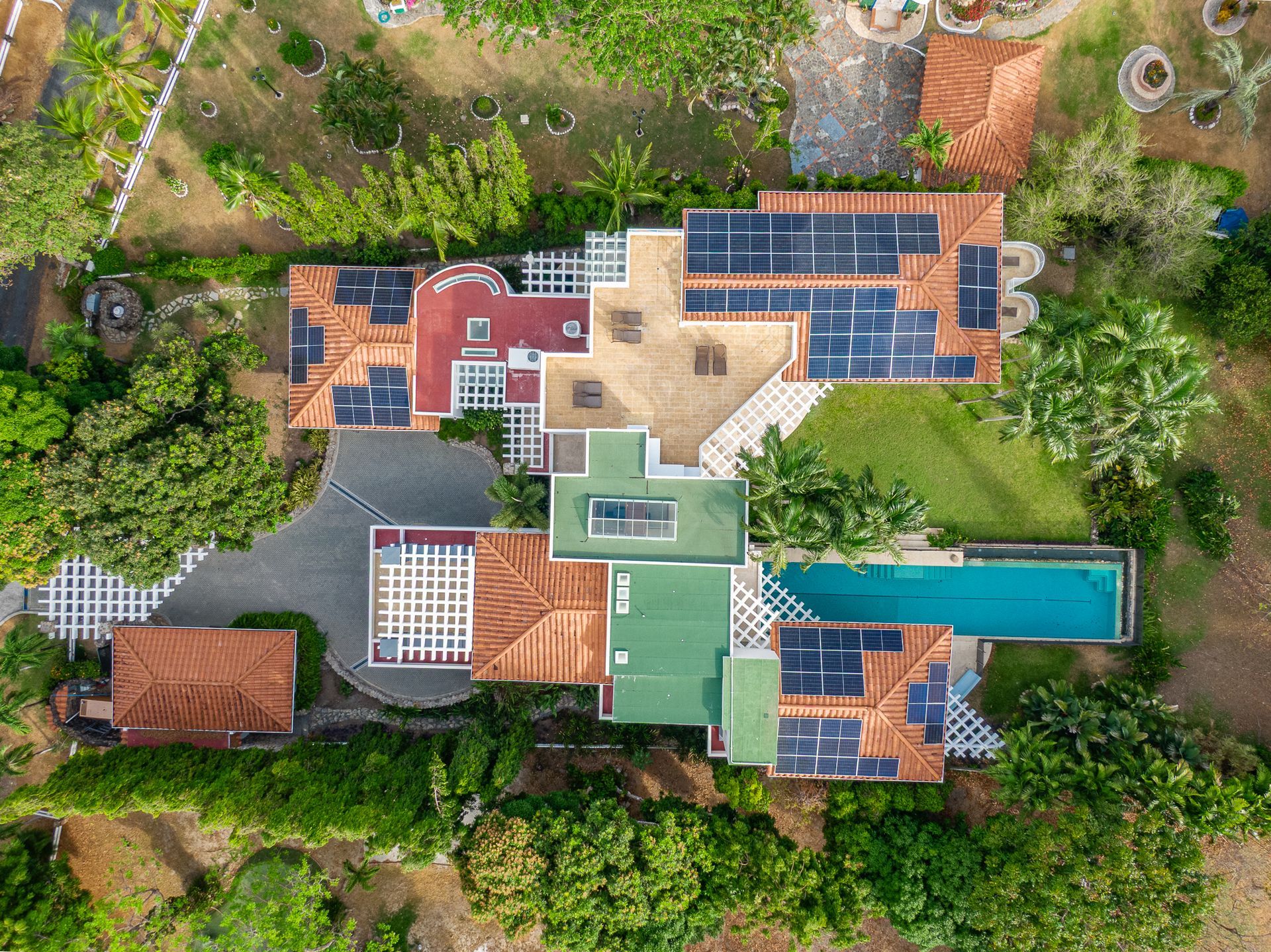Aerial drone photography of luxury mansion with solar panels in Punta Barco Panama.