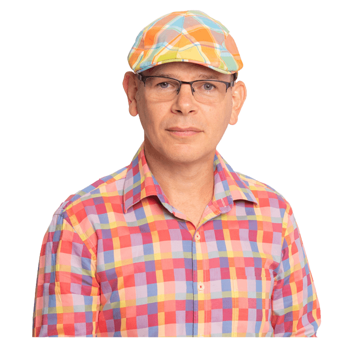 A man wearing a plaid shirt and a colorful hat