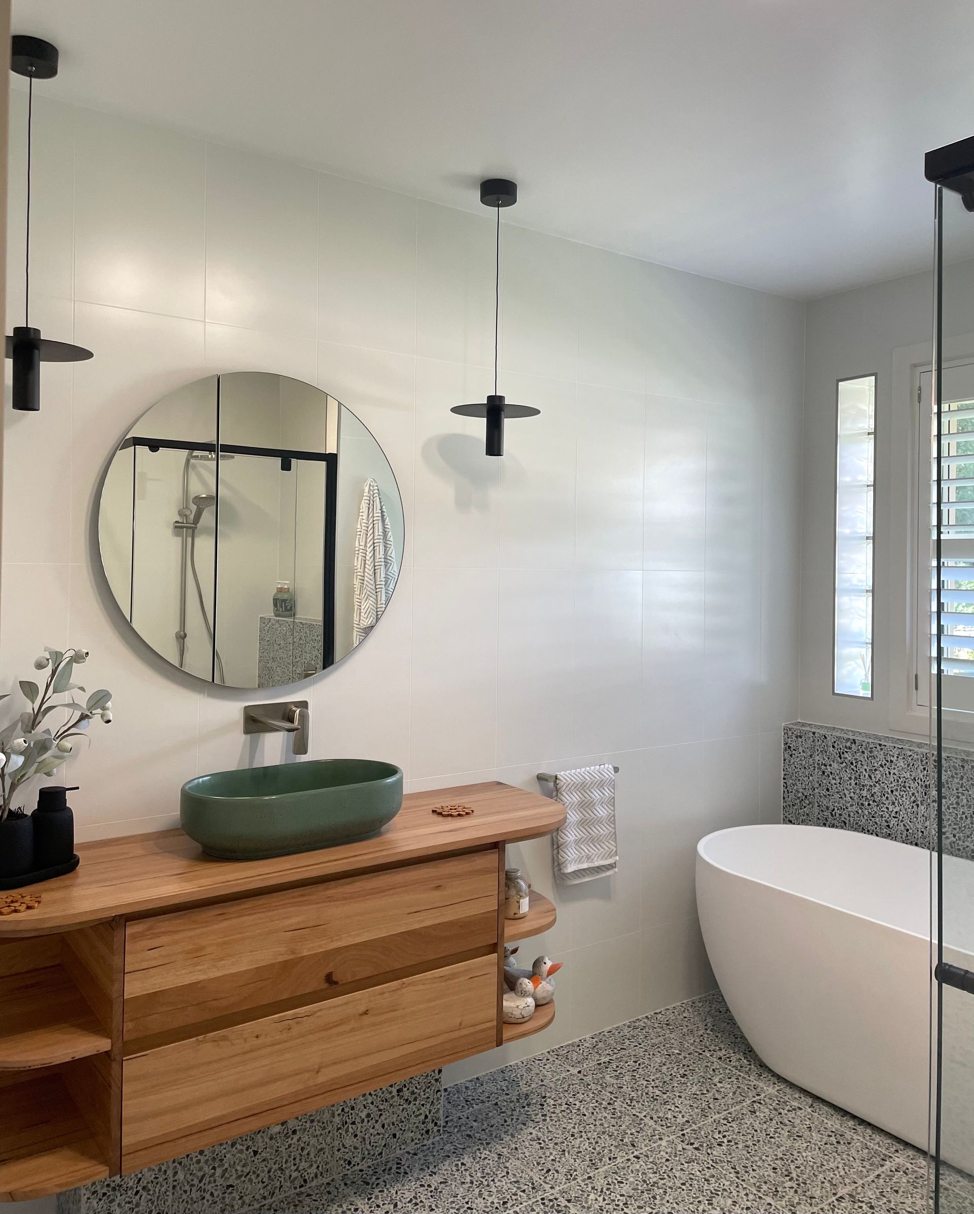 A Bathroom With A Sink, Bathtub And Mirror — Coffs Coast Designer Bathrooms in Toormina, NSW