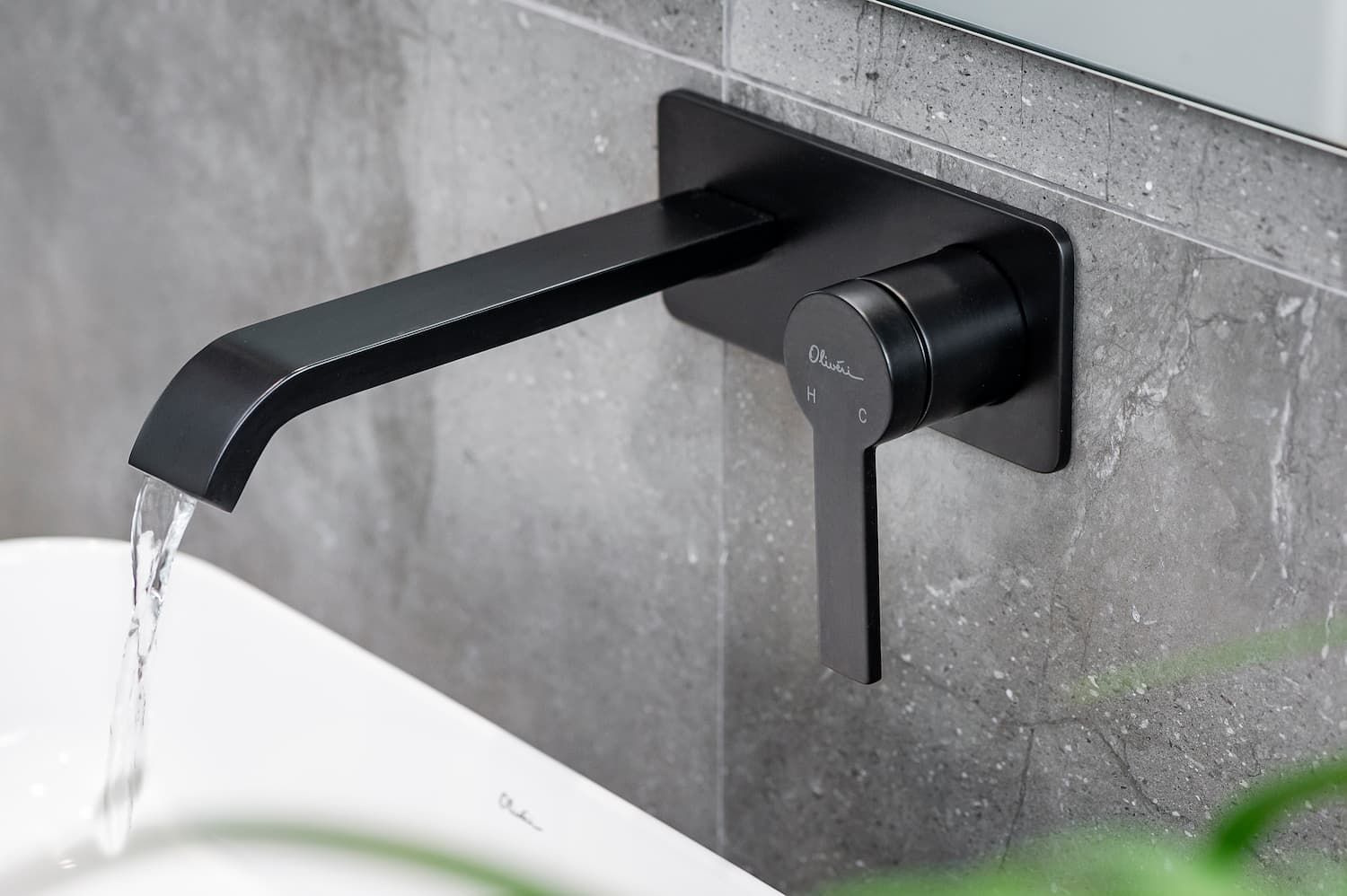 Black Matte Wall Mounted Faucet With Water — Coffs Coast Designer Bathrooms in Toormina, NSW