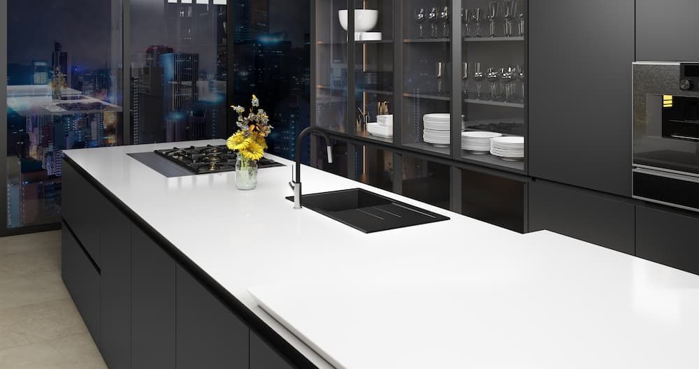 A Kitchen With A Stove Top Oven Next To A Counter — Coffs Coast Designer Bathrooms in Toormina, NSW